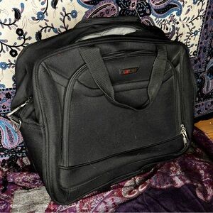 Delsey rolling carry on luggage bag